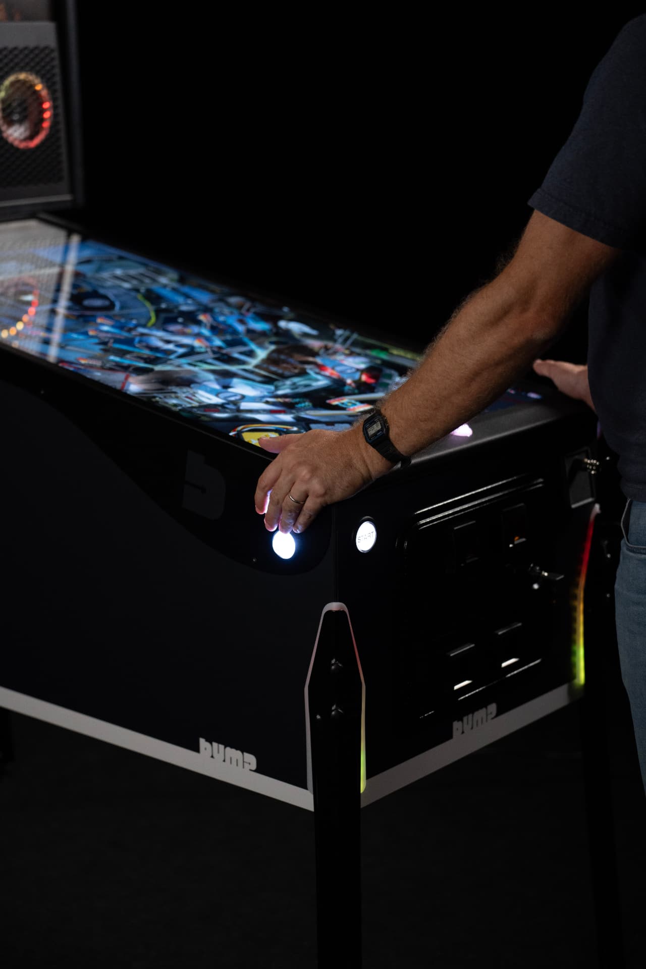 OLED screen and physical controls of a premium pincab